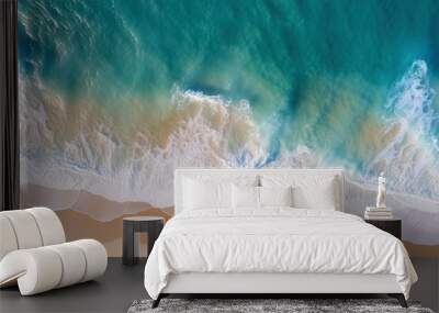 Ocean waves on the beach as a background. Beautiful natural summer vacation holidays background. Aerial top down view of beach and sea with blue water waves Wall mural