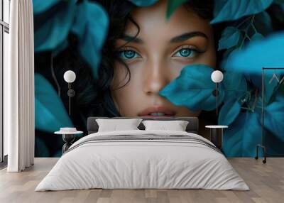 Portrait of a beautiful girl surrounded by cyan flowers. Young stunning woman in cyan Wall mural