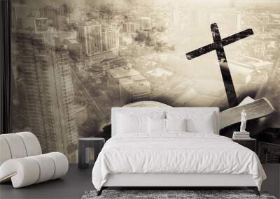 mixed media of cross and city and hand hold bible Wall mural