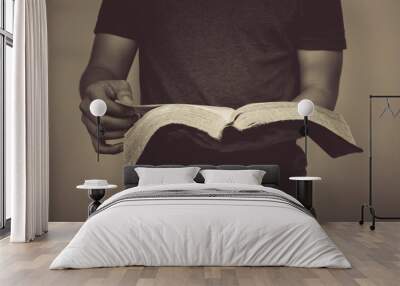 Vintage tone of man reading the Holy Bible. Wall mural