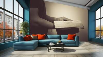 Vintage tone of man reading the Holy Bible. Wall mural