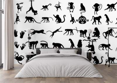  A set of monkey silhouettes on a white background. Perfect for designs about animals, nature, wildlife, primates, monkeys, apes, jungle, rainforest, conservation, and education Wall mural