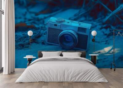 camera and lens on blue background Wall mural