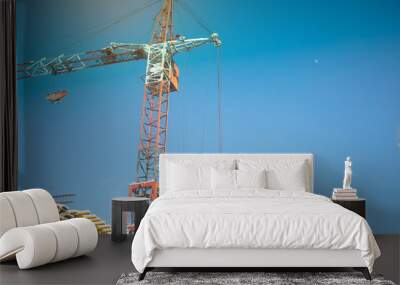 Construction site with cranes under sky Wall mural