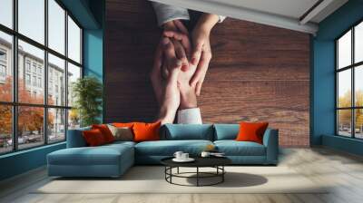 couple hand on wooden table Wall mural