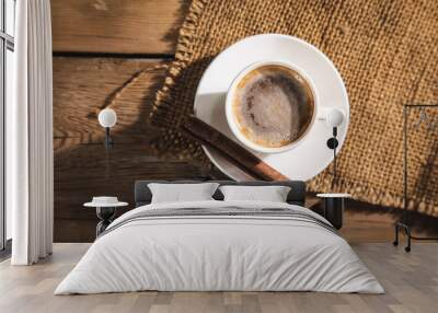 cup of coffee with beans and canvas with cinnamon Wall mural