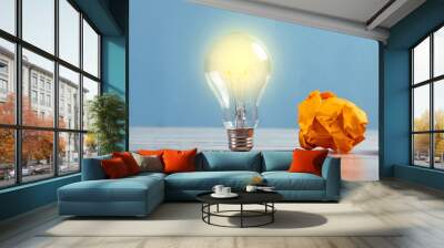 Light bulb and crumpled papers Wall mural