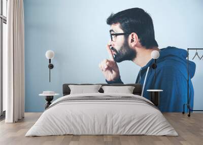 man finger on lips Wall mural