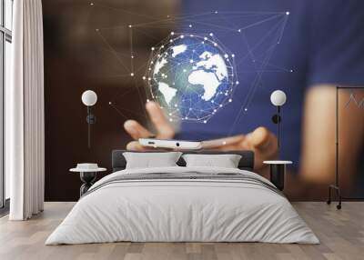 man hand with smartphone and virtual sphere globe Wall mural