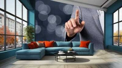 man tapping on virtual screen Wall mural