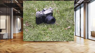 old camera on grass Wall mural