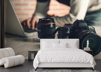 photographer hand camera working in desk Wall mural