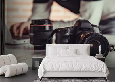 photographer hand camera working in desk Wall mural