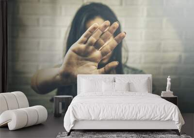 Young woman showing her denial with NO on her hand Wall mural