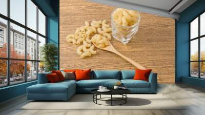 Gomiti Pasta or Elbow Macaroni on Wooden Table Wall mural