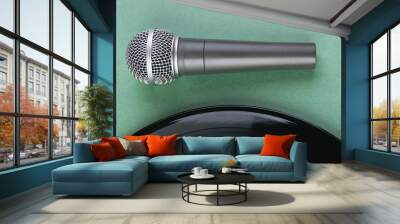 microphone and old vinyl record  on a green background Wall mural