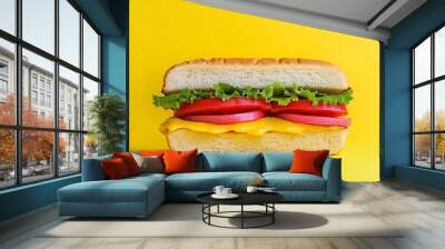 A Close-up of a Classic Cheeseburger on a Yellow Background Wall mural