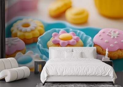 Close-up of colorful frosted cookies on a blue tray Wall mural