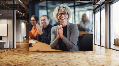 Mature Business Woman Celebrating in Office Wall mural