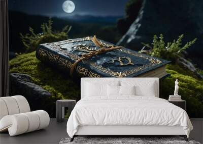 Cracked spellbook lying on a moss covered rock under moonlight Wall mural