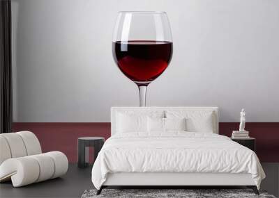 Elegant glass of red wine resting on a plain white background. Wall mural