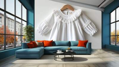 Medium white ruffled blouse for kid girls with lace trim on plain white background Wall mural