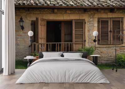 Wooden shutters swinging open on a stone cottage in a quiet village Wall mural