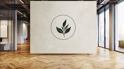 Minimalist logo design featuring a sprig of leaves growing inside a circle Wall mural