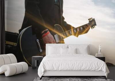 Guitarist playing outdoors Wall mural