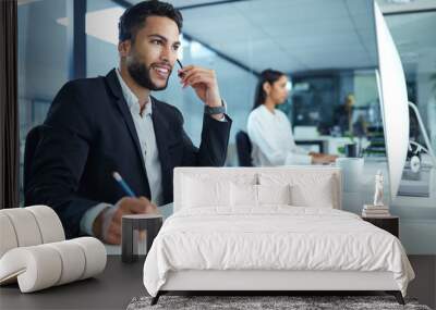 welcome how may i assist you. shot of a young businessman working in a call center. Wall mural