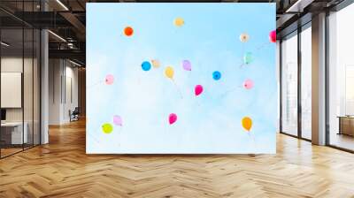 Colorful balloons on blue sky background. Wall mural