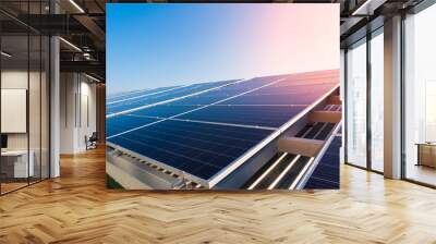 Solar panels and blue sky background.Solar cells farm on the roof.Photovoltaic modules for renewable energy.Save the earth and the energy with good environment concept. Wall mural