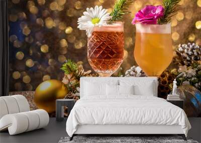 two glasses of coctail with christmas decoration on bokeh background Wall mural