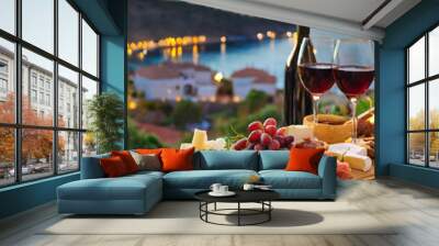 wine glasses, , cheese platter on a wooden board on the background of the Aegean sea Wall mural