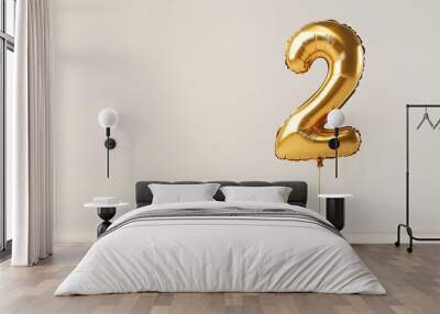 A shiny gold balloon shaped like the number 2 on a plain background. Wall mural