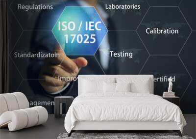 A businessman pointing to ISO IEC 17025, which is the standard of international quality association laboratory accreditations management system. Wall mural