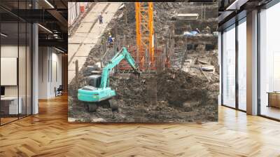 Aerial view of construction worker working in under construction area Wall mural