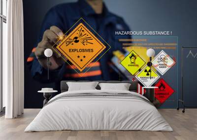 cargo staff or product inspector writing on explosives warning sign and inspect the storage of dangerous goods in the warehouse for operator safety such as explosions, radioactive, toxic gases, etc. Wall mural