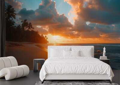 A beautiful sunset over the ocean with a palm tree in the background Wall mural