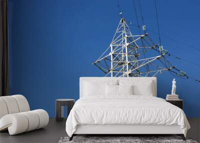 high-voltage transmission tower against a blue sky Wall mural