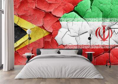 east timor flag with Iran flag on a grunge cracked wall Wall mural