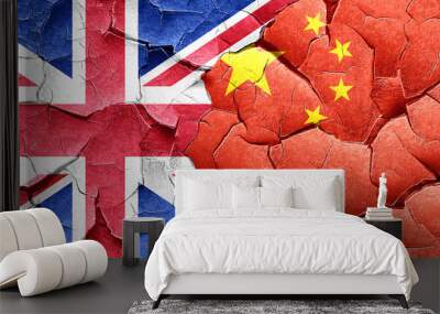 Great britain flag with China flag on a grunge cracked wall Wall mural