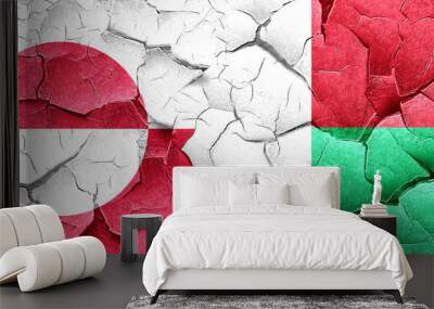 greenland flag with madagascar flag on a grunge cracked wall Wall mural