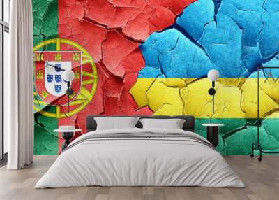 Portugal flag with rwanda flag on a grunge cracked wall Wall mural