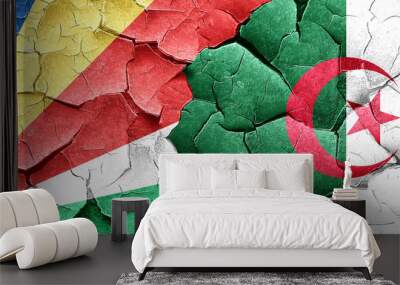 seychelles flag with Algeria flag on a grunge cracked wall Wall mural