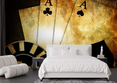 Vintage playing cards on a dark background with some poker chips Wall mural