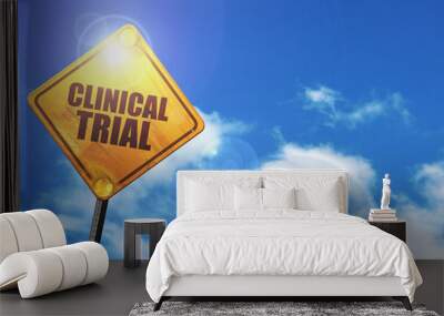 yellow road sign with a blue sky and white clouds: clinical tria Wall mural