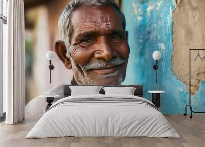 a handsome old senior asian indian model man smiling. used for a web or print ad. isolated on building house wall background. Wall mural