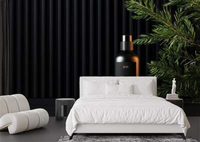 Elegant black spray bottle with natural foliage on dark background, minimalistic skincare product presentation. Wall mural