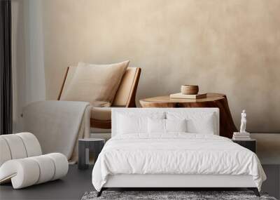 fabric lounge chair and wood stump side table against beige stucco wall with copy space. rustic mini Wall mural